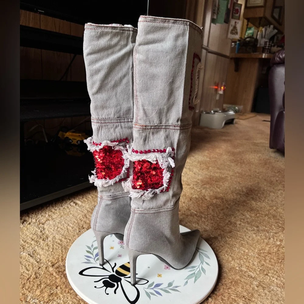 Woman’s multi-color red stone denim pointy toe knee-high boots.